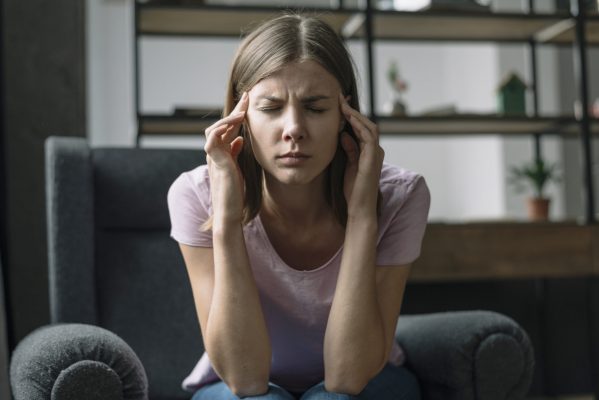close-p-o-young-woman-suffering-from-headache