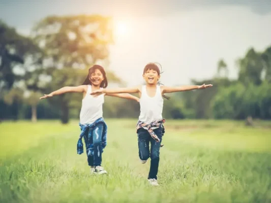two-little-cute-girls-are-running-green-grass-best-friends